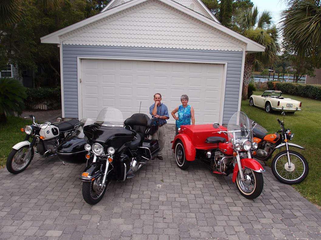 LAURA AND RICHARD ROESCH WITH JUST A FEW OF THEIR COLLECTIBLES, FROM LEFT: 1970 BMW R50/5, 2009 HARLEY DAVIDSON ULTRA, 1964 HARLEY DAVIDSON WITH SERVI-CAR, 1973 HONDA XL175