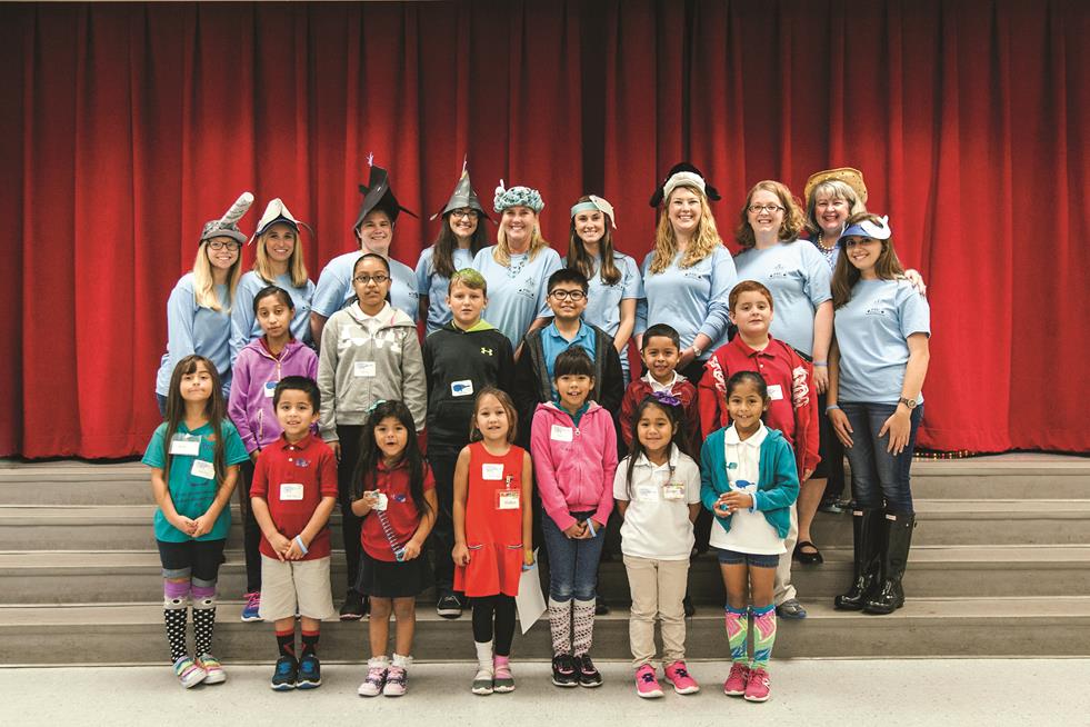 Seen in the picture are West Bay Elementary students standing in the first two rows. The Elementary Education at FSU PC are standing in the top row. Top Row from left to right: Danielle Gainer, Kristina Price, Blanche Powell, Tricia Mitchell, Rhonda Richey, Josie Doll, Alicia Gainer , and Amber Torres, Cristina Rios, and front right, Alexandra Hall.